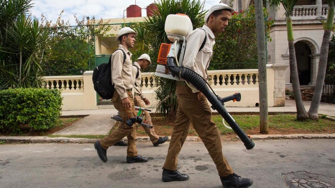 File photo of government fumigators as they prepare to spray homes for mosquitos in Havana, Cuba.