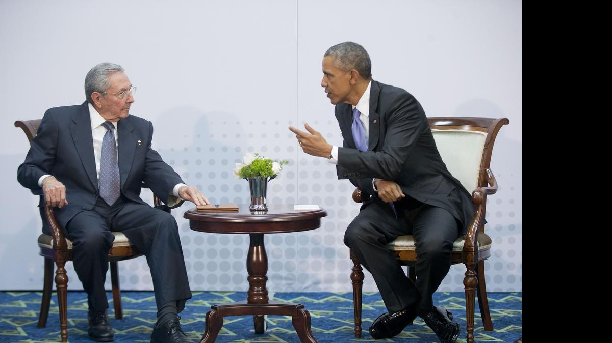 
US President Barack Obama, right, leans over towards Cuban President Raul Castro during their meeting at the Summit of the Americas in Panama City, Panama, Saturday, April 11, 2015. As of Friday, the United States no longer considered Cuba a state sponsor of terrorism, provoking impassioned reaction on both sides of the issue. 
