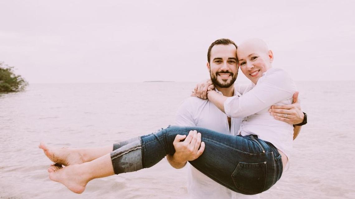 
Felice Gorordo holds his mother, Martha Serra Mohr, who has pancreatic cancer. They are going to Cuba to see Pope Francis in a pilgrimage of the Miami Archdiocese.

