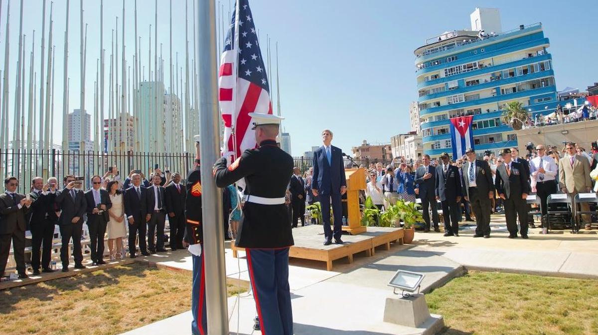 Former Secretary of State John Kerry, and other dignitaries watch as U.S. Marines raise the U.S. flag over the newly reopened embassy in Havana, Cuba. Friday, Aug. 14, 2015.