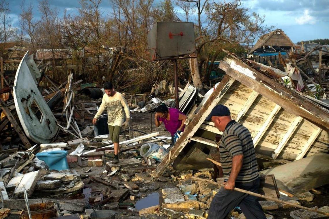 Cubans try to save their belongings in their destroyed house in Isabela de Sagua, Cuba, on Sept. 11, 2017, after the passage of Hurricane Irma.
