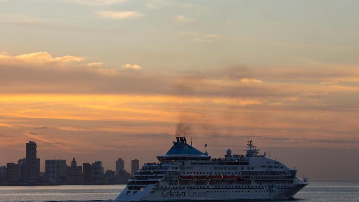 The Celestyal Crystal cruise ship departs Havana as the sun sets on Tuesday, Dec. 22, 2015. This winter season, it is offering people-to-people itineraries that allow American to legally cruise Cuban waters.