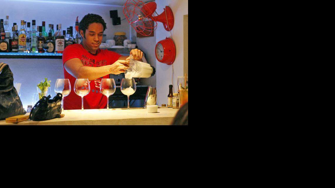
Bartender Wilson Hernandez, makes a daiquiri at O'Reilly 304 Gin Bar and Restaurant, where private enterprise meets cocktails.


