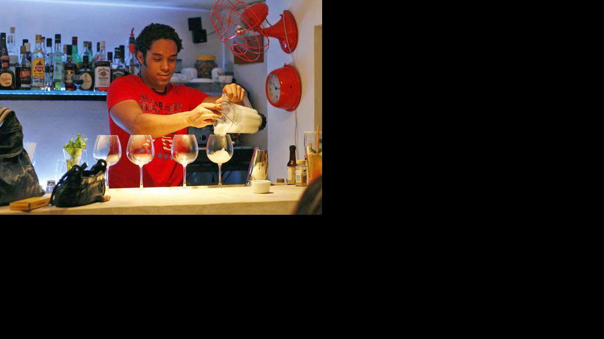 
Bartender Wilson Hernandez, makes a daiquiri at O'Reilly 304 Gin Bar and Restaurant, where private enterprise meets cocktails.



