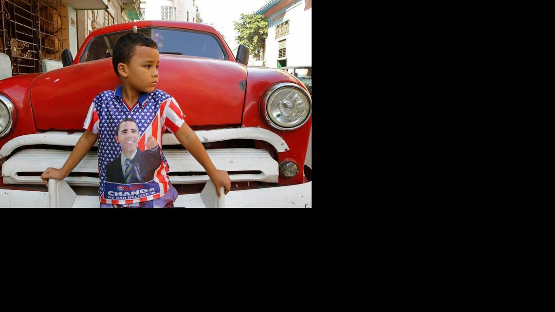A child wearing a shirt bearing the image of U.S. President Barack Obama poses for a portrait in Havana, Cuba, in January 2015.