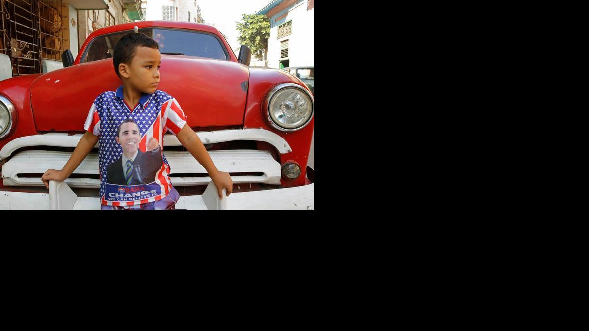A child wearing a shirt bearing the image of U.S. President Barack Obama poses for a portrait in Havana, Cuba, in January 2015.