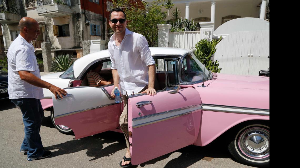 
Airbnb Co-founder Nathan Blecharczyk gets out of a classic American car taxi as he arrives at the guesthouse of Armando Usain in Havana. Airbnb is one of the first major U.S. businesses to venture into Cuba since the U.S. and Cuba began a process of normalizing relations last December.
