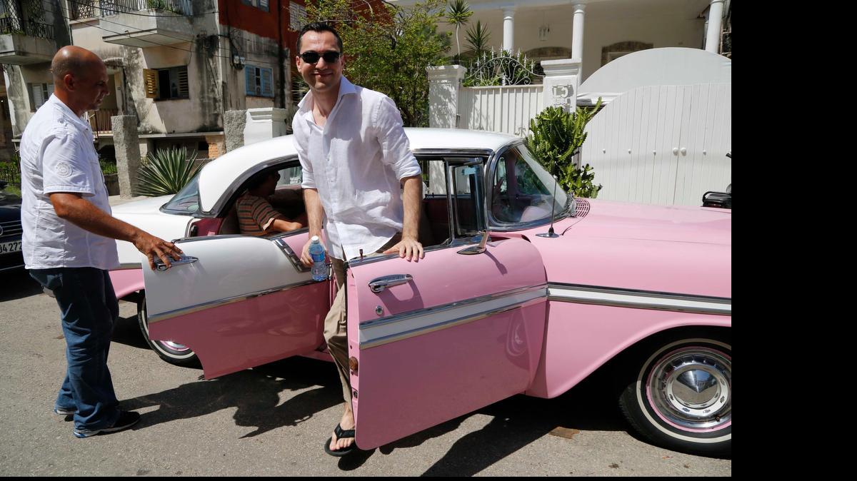 
Airbnb Co-founder Nathan Blecharczyk gets out of a classic American car taxi as he arrives at the guesthouse of Armando Usain in Havana. Airbnb is one of the first major U.S. businesses to venture into Cuba since the U.S. and Cuba began a process of normalizing relations last December.
