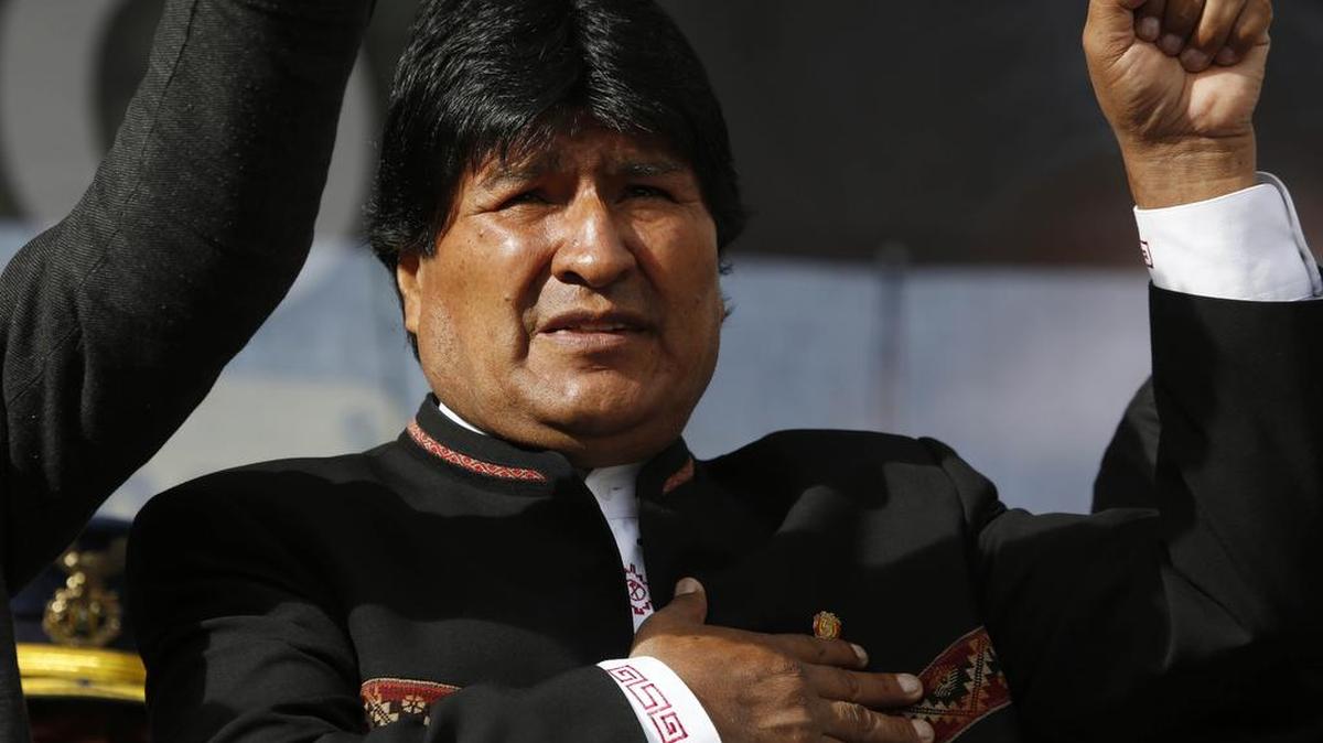 Bolivia's President Evo Morales sings his national anthem at a signing ceremony for the expansion of a road that connects the capital with the nearby city of El Alto, in La Paz, Bolivia, Monday, Feb. 22, 2016, one day after a referendum on expanding presidential term limits. Partial results Monday and unofficial "quick counts" indicated Morales' bid to extend his presidency by amending the constitution appeared headed toward defeat. (AP Photo/Juan Karita)