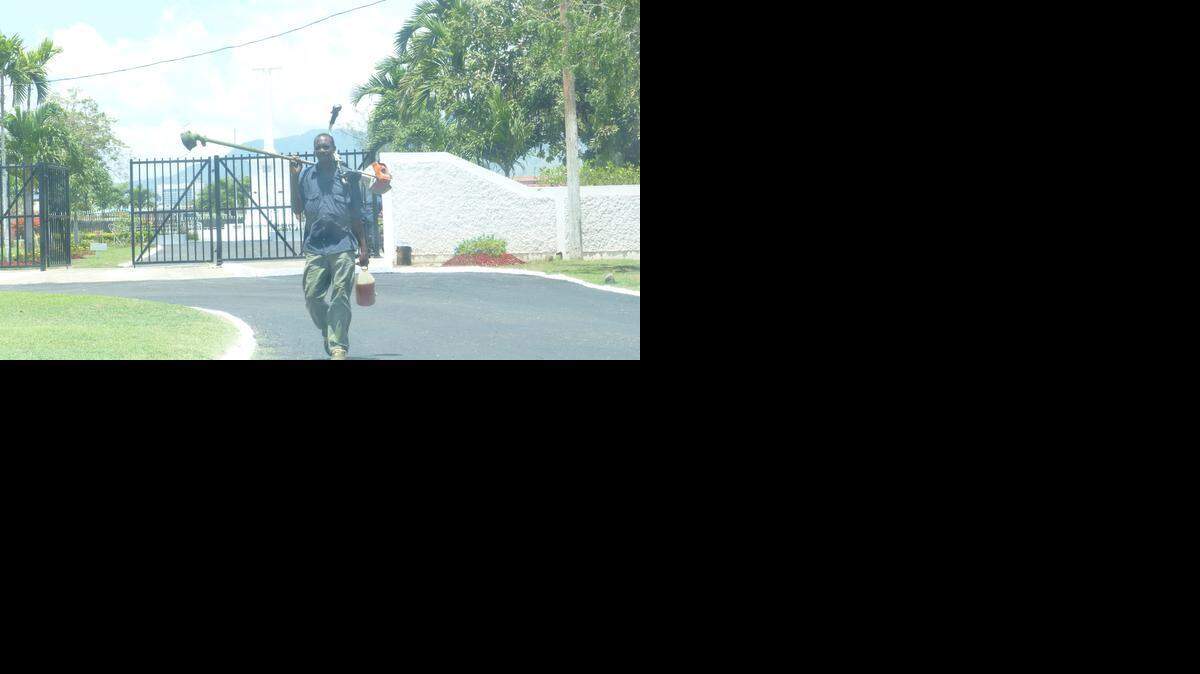 
The driveway to National Heroes Park, like other streets that President Barack Obama will travel, received a fresh coat of tar ahead of Obama’s overnight visit to Kingston, Jamaica..
