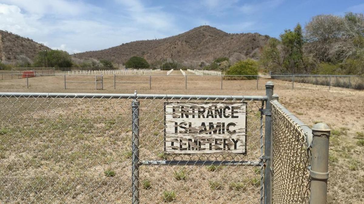 The sign showing the portion segregated for Muslims was cracked and faded on Friday, July 24, 2015 at the cemetery at the U.S. Navy base at Guantánamo Bay, Cuba, in a photo approved for release by the base spokeswoman.