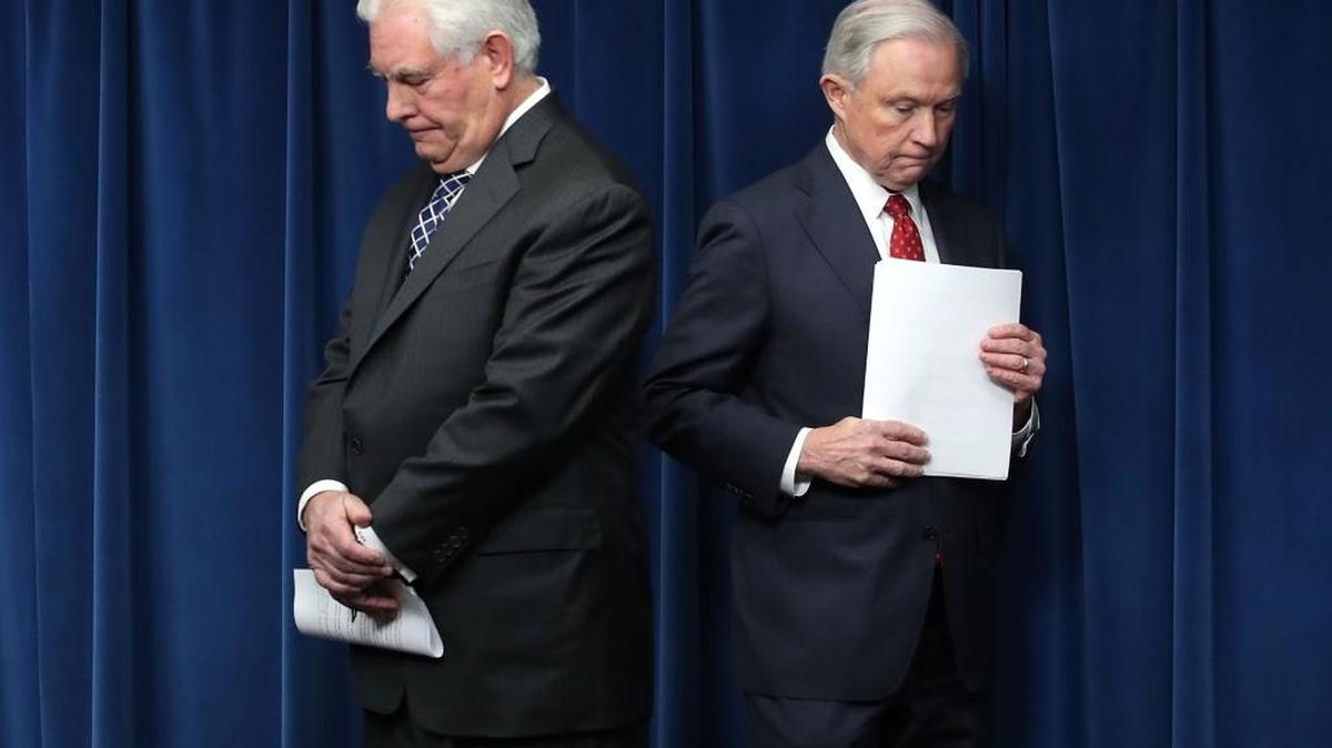 Secretary of State Rex Tillerson, left, and Attorney General Jeff Sessions take part in a news conference related to a reconstituted travel ban at the U.S. Customs and Borders Protection headquarters, on March 6, 2017 in Washington, D.C.