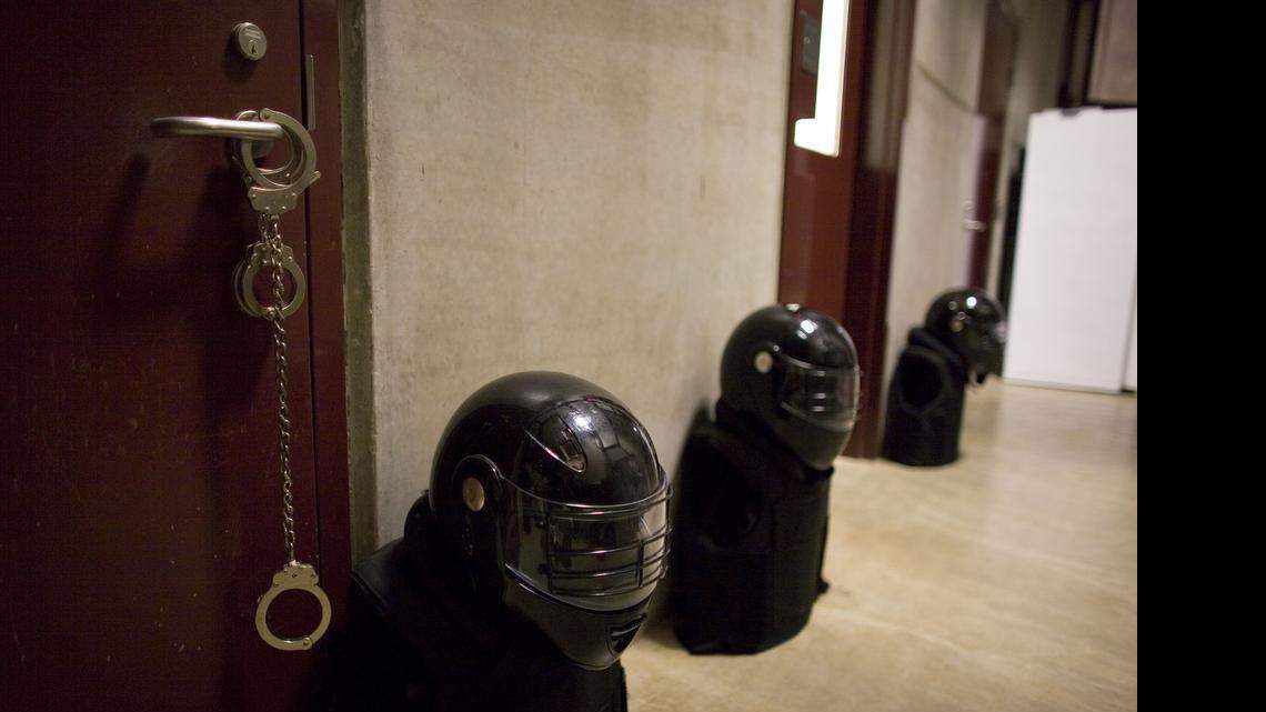 
Forced cell extraction team gear, including riot helmets, flak jackets and hand cuffs were in plain view inside the Camp 6 prison at the U.S. Navy Base at Guantánamo Bay, Cuba, on Nov. 19, 2008.
