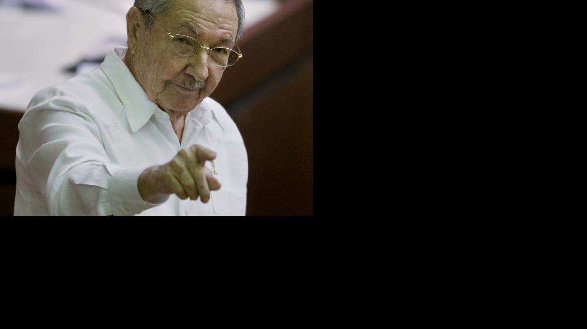 
In this Dec. 20, 2014 file photo, Cuba's President Raul Castro points to the press during the closing of the legislative session at the National Assembly in Havana, Cuba. 
