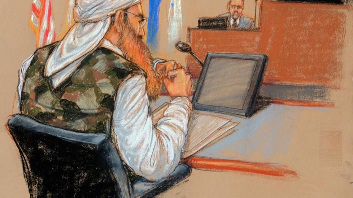 In this photo of a sketch by courtroom artist Janet Hamlin and reviewed by the U.S. Department of Defense, Khalid Sheik Mohammed sits at a defense table wearing a camouflage vest in front of military judge U.S. Army Col. James Pohl, right, during a pretrial hearing at the U.S. Navy base at Guantánamo Bay Cuba on Oct. 17, 2012.