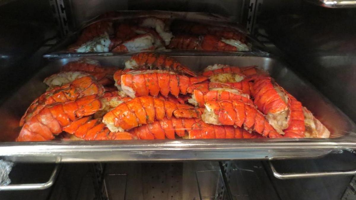 Lobster tails for the troops at the Detention Center Zone chow hall on surf-and-turf day, Friday, Dec. 13, 2013. The line for the $4.60 meals stretched out the door of the dining room alternately called the Camp America and Seaside Galley that day. Today, lunch costs $5.55.