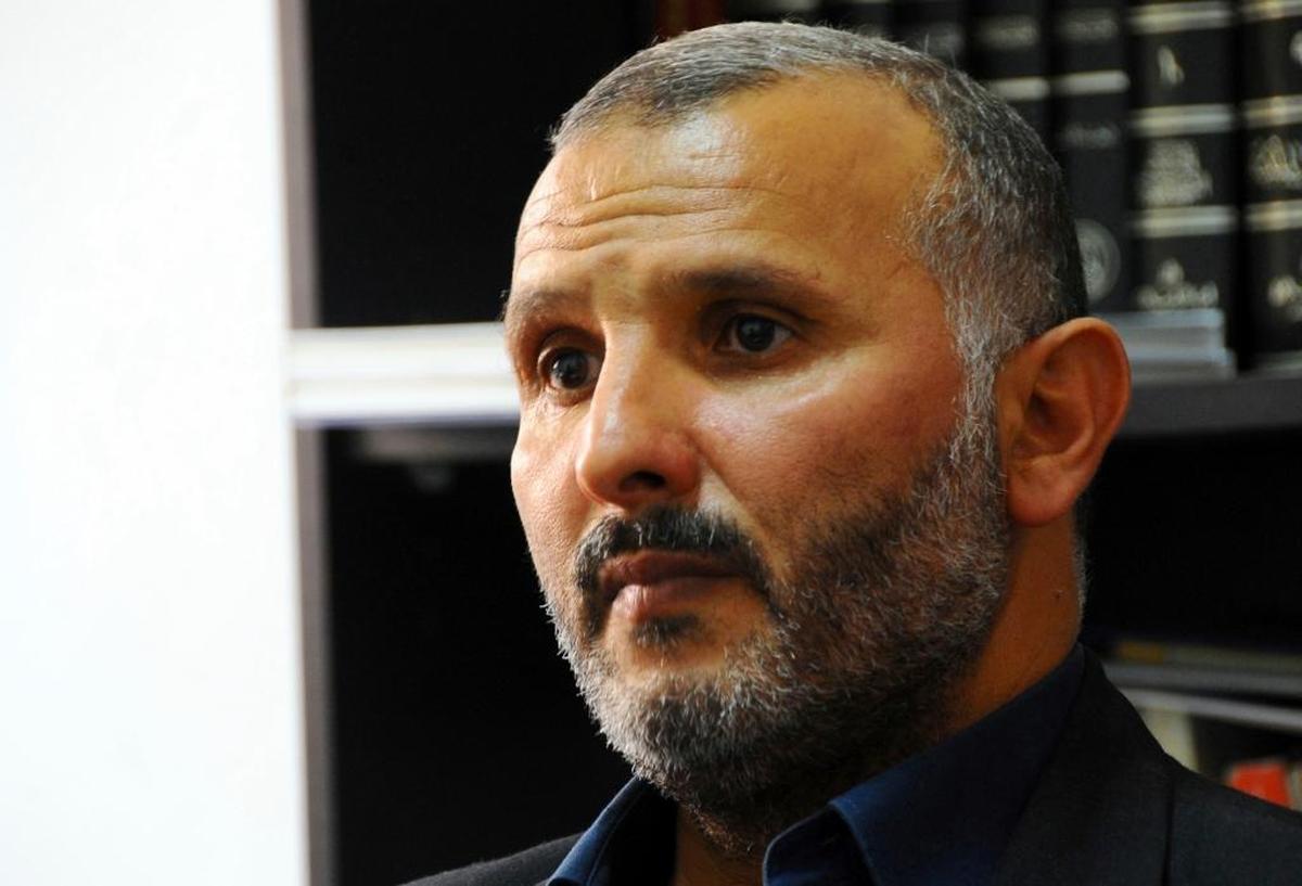 In this photo dated Saturday, June 10, 2017, Hedi Hammami, a former Guantánamo detainee, speaks during an interview with the Associated Press at his lawyer office in Tunis, Tunisia.