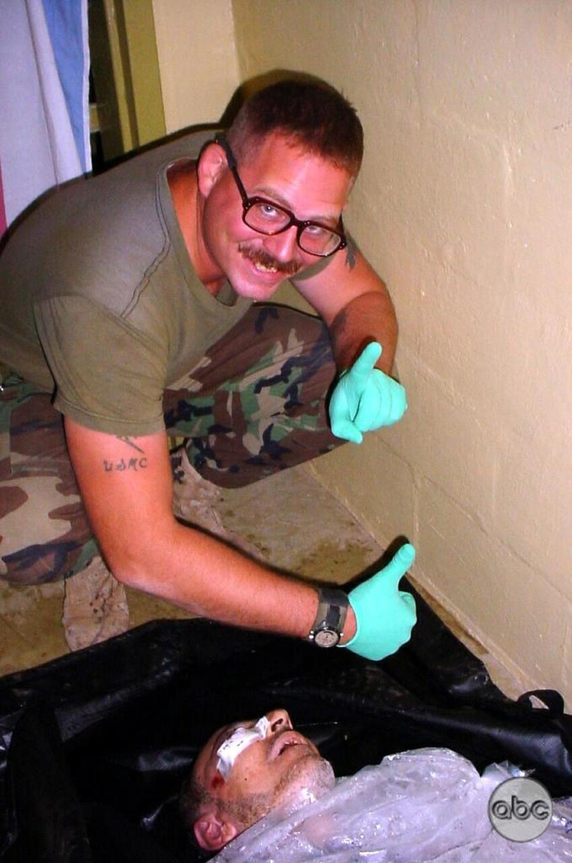 Army Sgt. Charles Graner of the 372nd Military Police Company poses with the body of an Iraqi man packed in ice in this undated photo, released by ABC News on May 19, 2004.