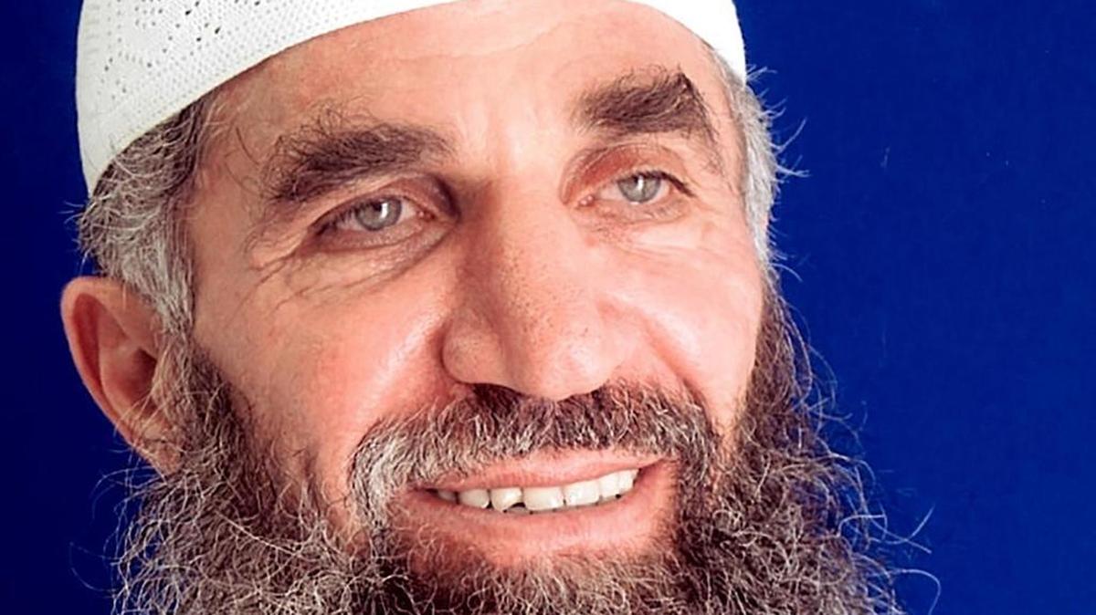 Guantánamo prisoner Abd al Hadi al Iraqi, who says his true name is Nashwan al Tamir, poses for the International Committee of the Red Cross in a 2014 photo taken for his family, and provided by his attorneys.