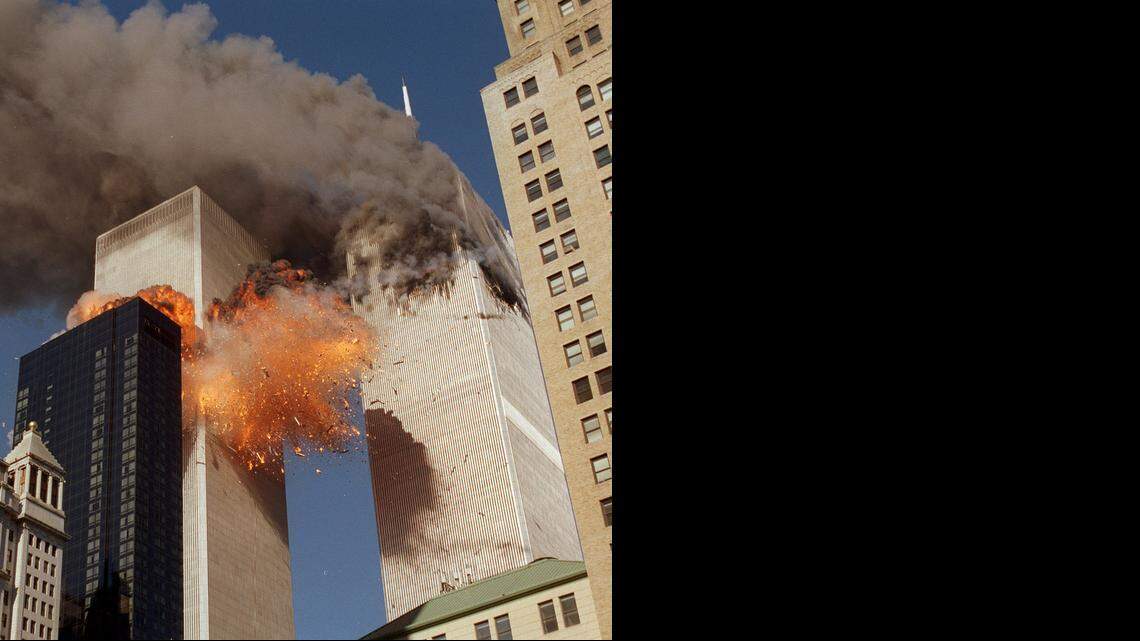 
Smoke billows from one of the towers of the World Trade Center and flames and debris explode from the second tower on Tuesday, Sept. 11, 2001.
