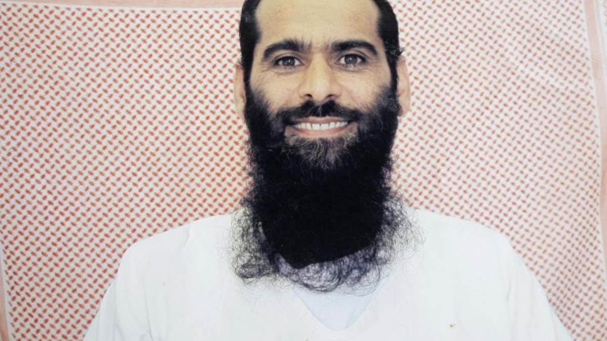 Muhammed Rahim al-Afghani poses for the International Committee of the Red Cross at the prison at the U.S. Navy base at Guantánamo Bay, Cuba, in a photo the Associated Press obtained in 2012 from the Afghan’s family.