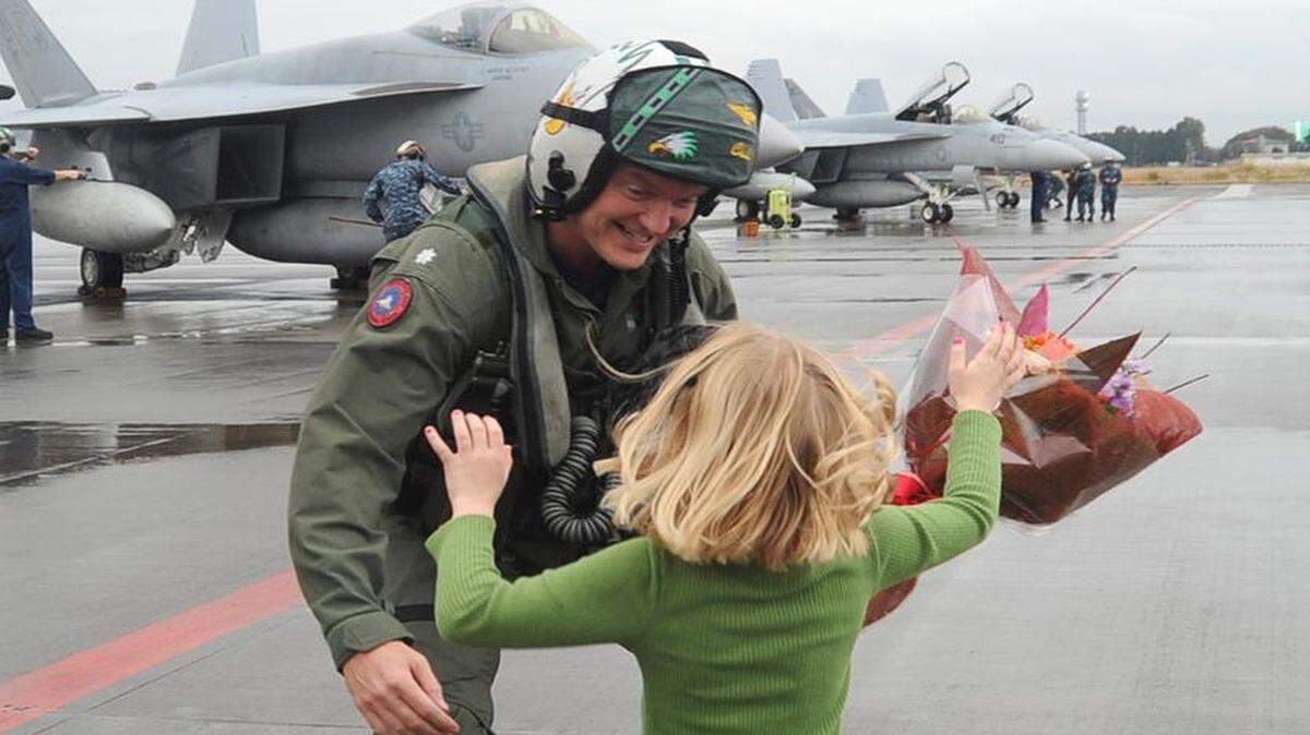 
Then-Commander David Culpepper in a Nov. 19, 2011 U.S. Navy photo being greeted by his daughter on return to Atsugi, Japan, from a deployment on the aircraft carrier USS George Washington.
