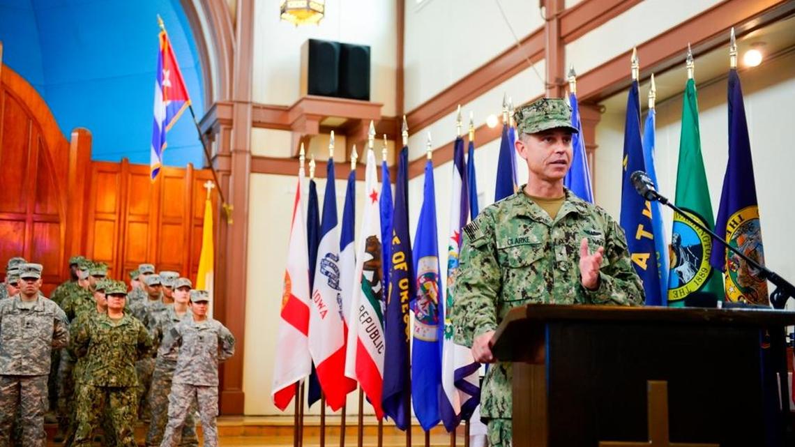 Rear Adm. Peter J. Clarke addresses troops as he relieves Air Force Brig. Gen. Jose R. Monteagudo in a photo released by the Guantánamo detention center spokesman on Nov. 4, 2015.Chapel Oct. 4.