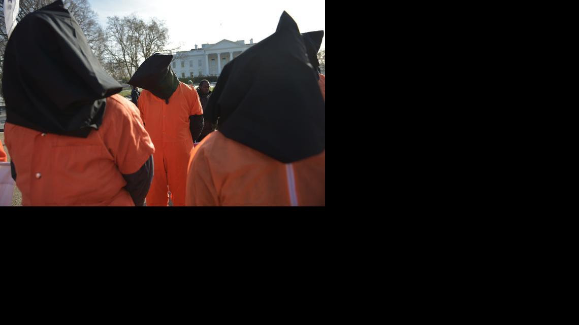 
Hooded protesters take part in a demonstration against the Guantánamo Bay detention facility on Jan. 11, 2015 outside of the White House in Washington, D.C. 
