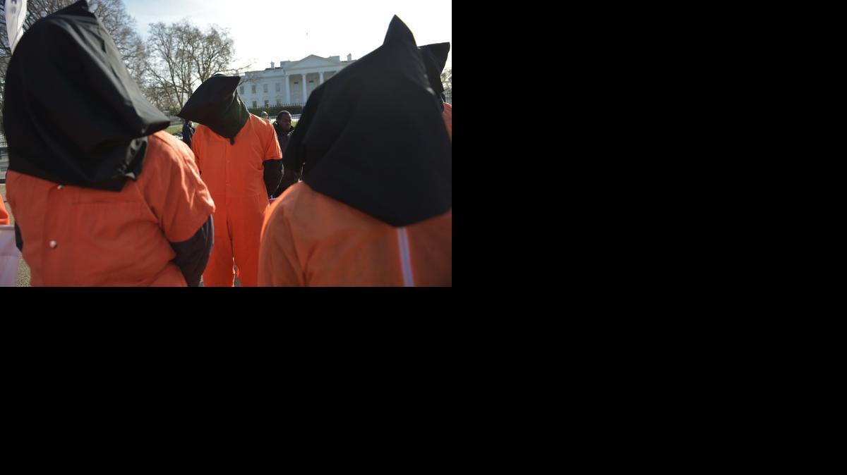 
Hooded protesters take part in a demonstration against the Guantánamo Bay detention facility on Jan. 11, 2015 outside of the White House in Washington, D.C. 
