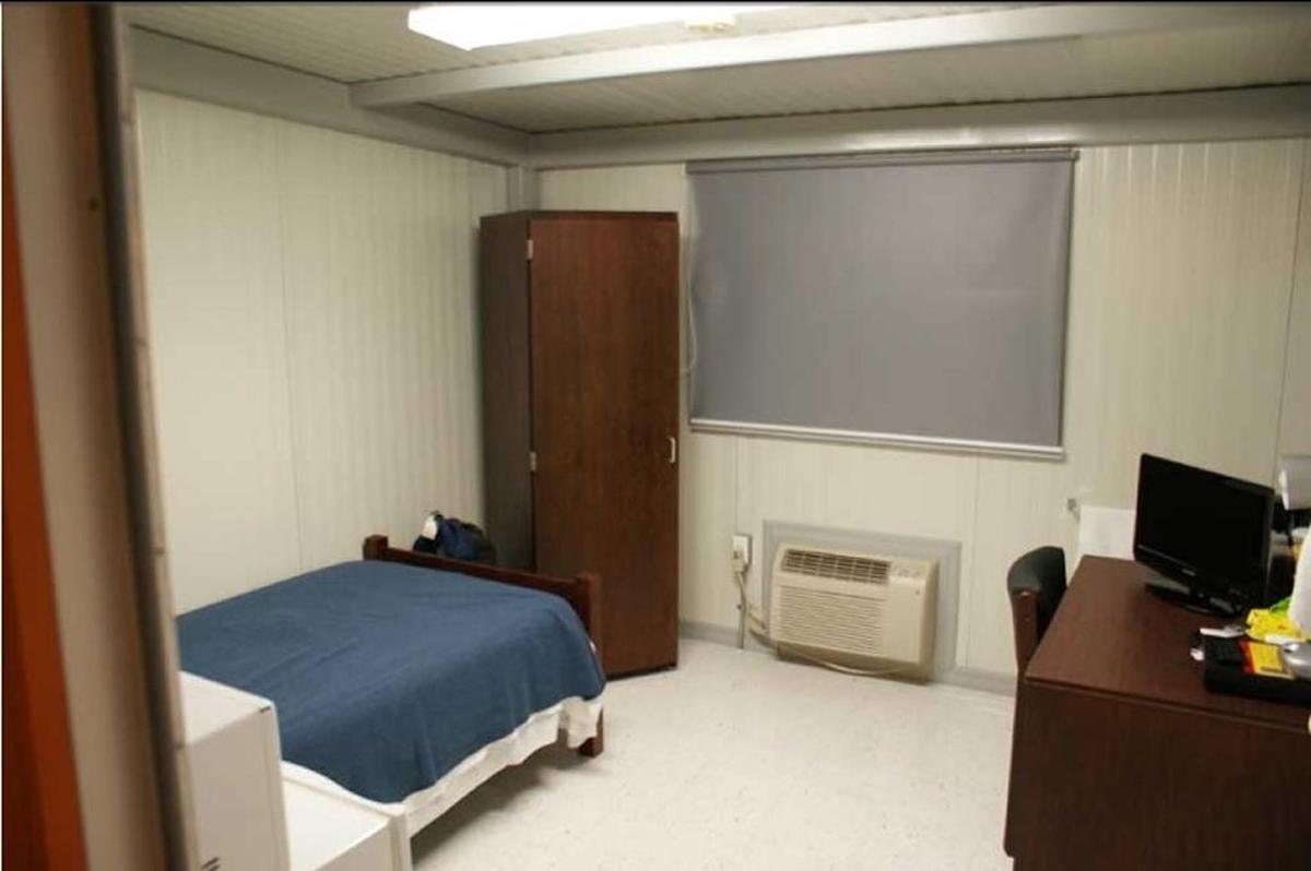 A view from the doorway of a room in the Camp Justice trailer park where the chief of war court defense lawyers was sentenced to spend 21 days. This image for a time appeared in the facilities section of the war court website whose motto is Fairness * Transparency * Justice.
