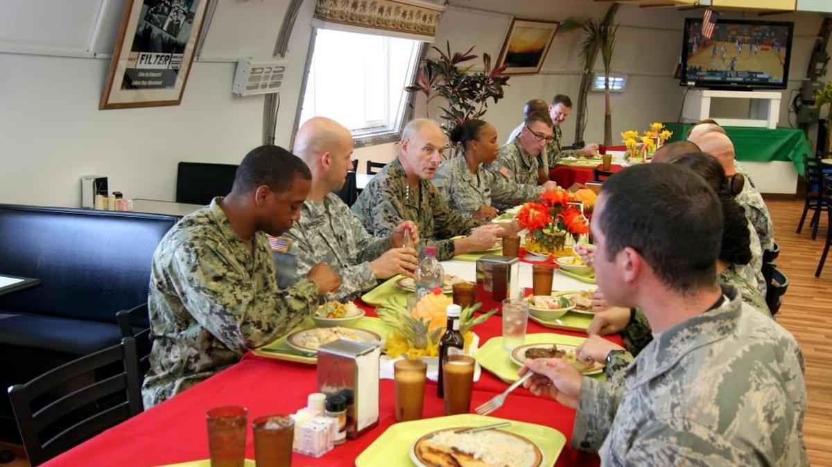 Marine Gen. John Kelly at lunch with service members at “Seaside Galley,” the prison staff dining room at the U.S. Navy base at Guantánamo Bay, Cuba, in this military handout photo from Feb. 19, 2015.
