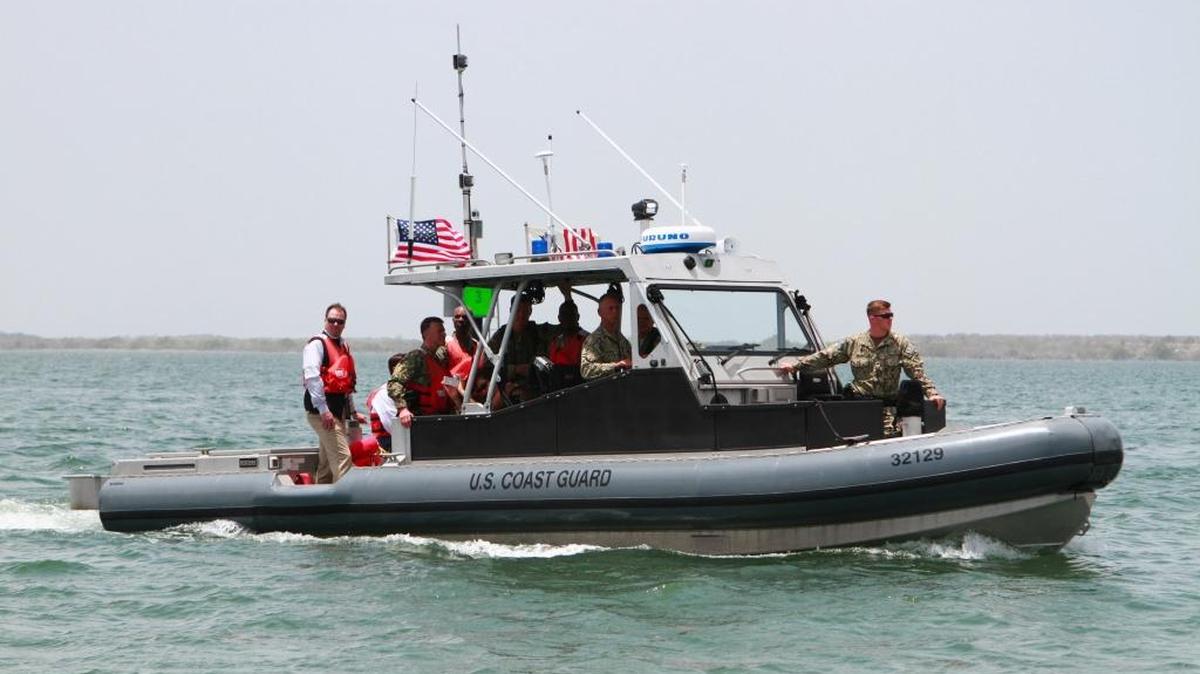 Commandant of the Coast Guard Adm. Paul F. Zukunft being escorted across Guantánamo Bay by Port Security Unit 308, Maritime Security Detachment in this April 29, 2015, photo released by the Detention Center.