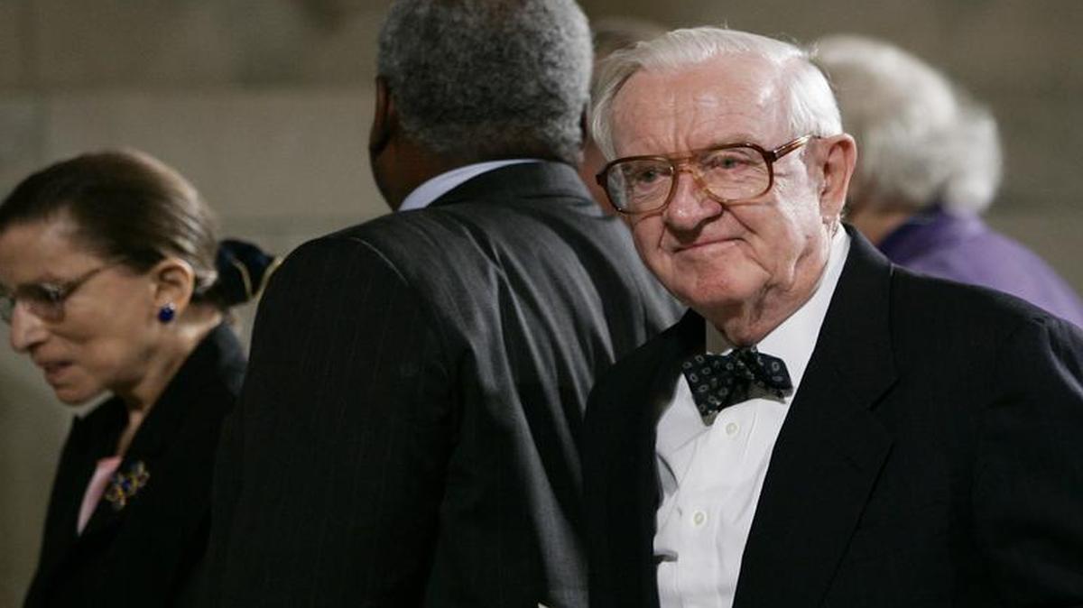 
In this photo taken June 15, 2006, Associate Justice John Paul Stevens, center, stands as he and other justices leave a memorial for the late Chief Justice William H. Rehnquist, at the Supreme Court in Washington, D.C. 
