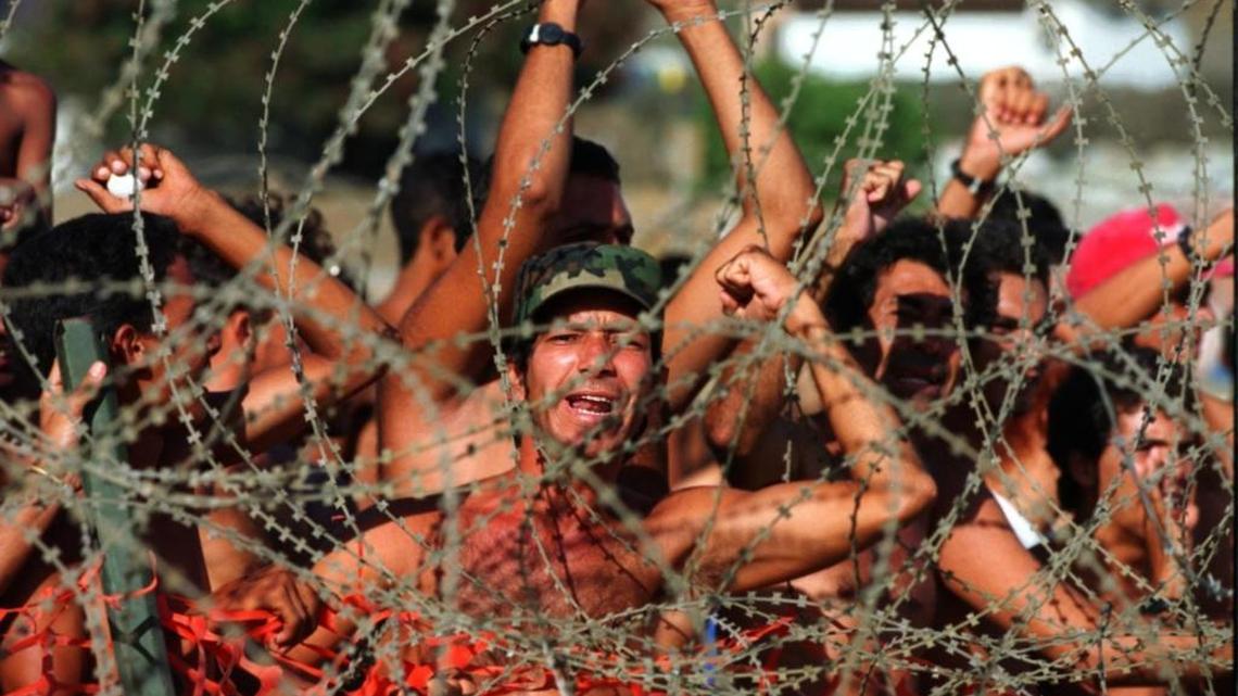 A Miami Herald file photo from the U.S. Navy base at Guantánamo Bay, Cuba, where Cubans interdicted at sea on their way to Florida shouted, “Liberty, Liberty” from inside a migrant tent camp on Sept. 2, 1994.