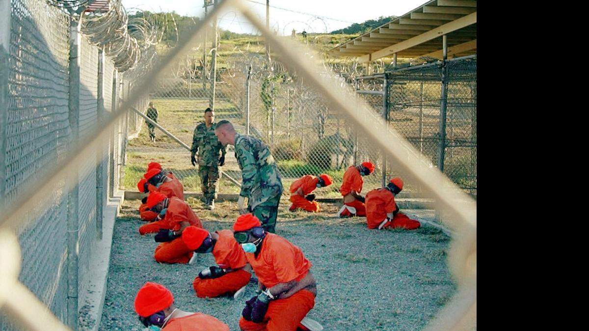 
Three of the five Taliban detainees traded for POW Bowe Bergdahl on May 31, 2014 were brought to Camp X-Ray at Guantánamo the day it opened, Jan. 11, 2002, as captured by a Navy photographer during inprocessing.
