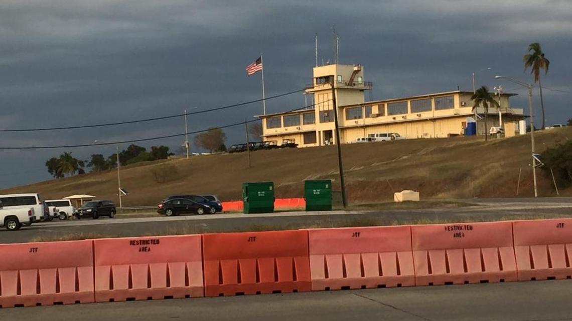 Storm clouds gather over a hilltop building used by the chief prosecutor and other attorneys at Camp Justice, at U.S. Navy base Guantánamo, on Feb. 25, 2016 in a photo approved for release by the U.S. military.