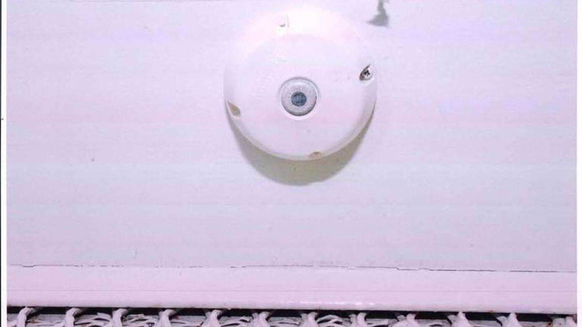 On March 11, 2013, the Guantánamo war court released this photo of a ‘smoke detector’ microphone that was found inside a meeting room at the prison’s Camp Echo compound where attorneys have met their captive clients for years at the U.S. Navy base in Cuba. Prosecutors in the Sept. 11 terrorism case argued in court that there was no effort to conceal the device, whose purpose was clearly labeled. In the USS Cole case, the judge said another episode involving a microphone was classified, and prohibited investigation or a hearing.