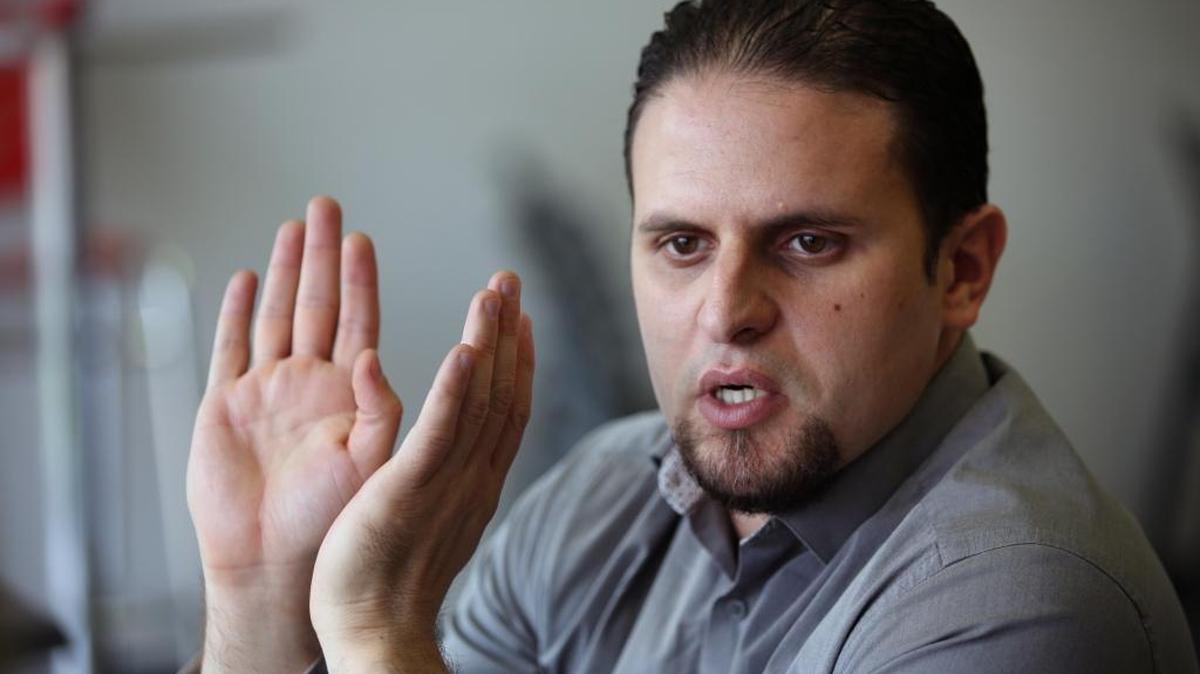 In this May 13, 2015 photo, former Guantánamo detainee and al-Qaida trainee Mourad Benchellali talks during an interview with the Associated Press in Gennevilliers, suburban Paris, France