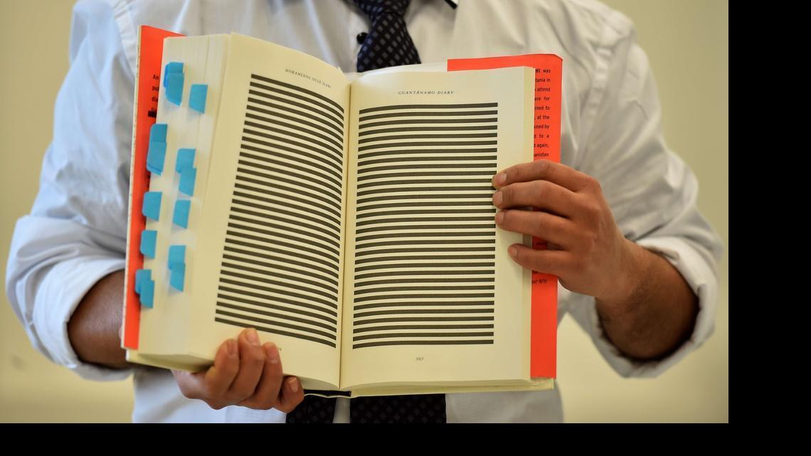 
The younger brother of Mohamedou Ould Slahi, Yahdih Ould Slahi, with a copy of Mohamedou’s prison memoir in London on Jan. 20, 2015 showing pages that were redacted by the U.S. government.
