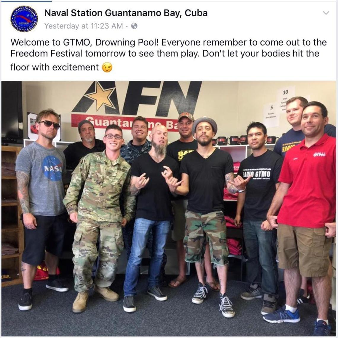 Members of the band Drowning Pool pose with locals at Radio Gitmo, a Navy run broadcaster at the U.S. Navy base at Guantánamo Bay, Cuba, on July 3, 2017.
