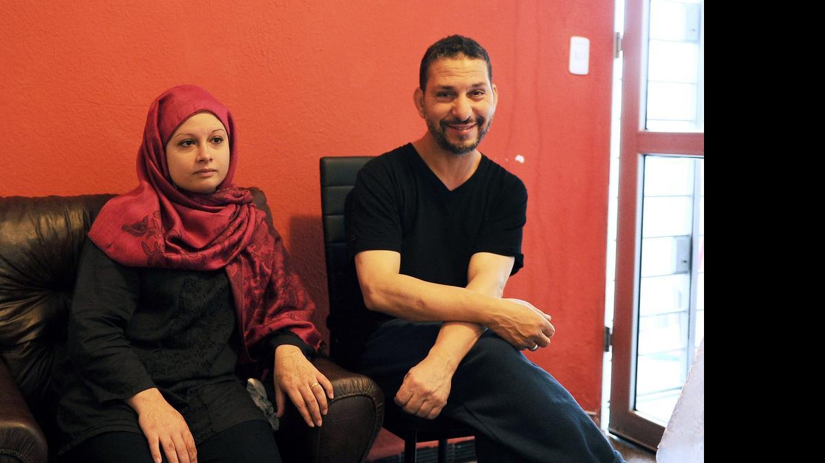 
Newlywed Adel bin Muhammad el Ouerghi, right, a former Guantánamo inmate now resettled in Uruguay, poses with his bride, who converted to Islam and took on the name Samira, at their house in Montevideo, on June 6, 2015, a day after tying the knot . 

