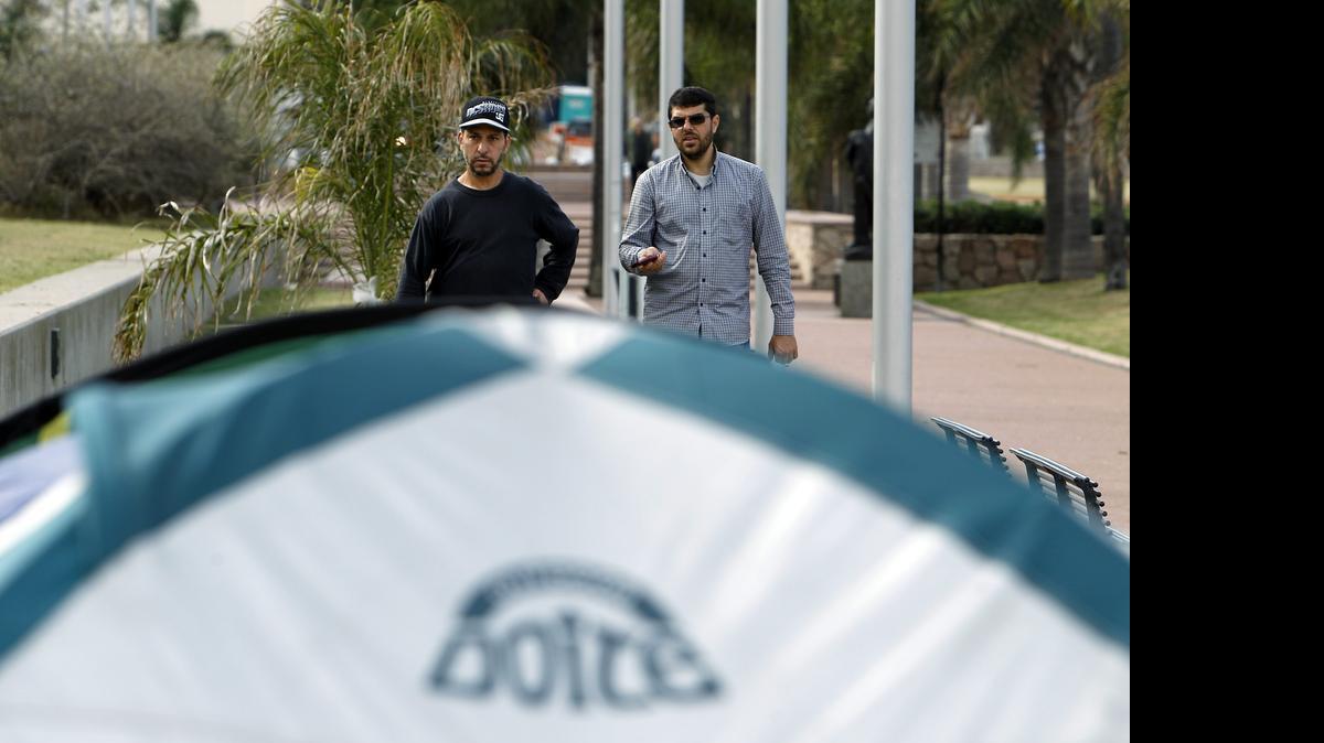 
Tunisian Adel bin Muhammad El Ouerghi, left, and Syrian Omar Abdelhadi Faraj Ouerghi, right on May 13, 2015 outside the U.S. Embassy in Montevideo.

