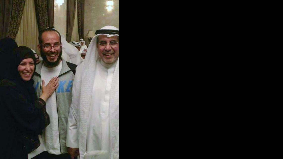 
A handout picture released by the family shows Fawzi al Odah, center, posing with his father and a relative as he was welcomed at a military hospital in Kuwait City upon his arrival in the Gulf state on Nov. 6, 2014 — the same day he was released from Guantánamo after nearly 13 years in U.S. custody. After a week, Fawzi al Odah will be transferred to a government-run rehabilitation center for an unspecified period but his close relatives will be allowed to visit him, according to AFP/Getty Images, which provided the image. 
