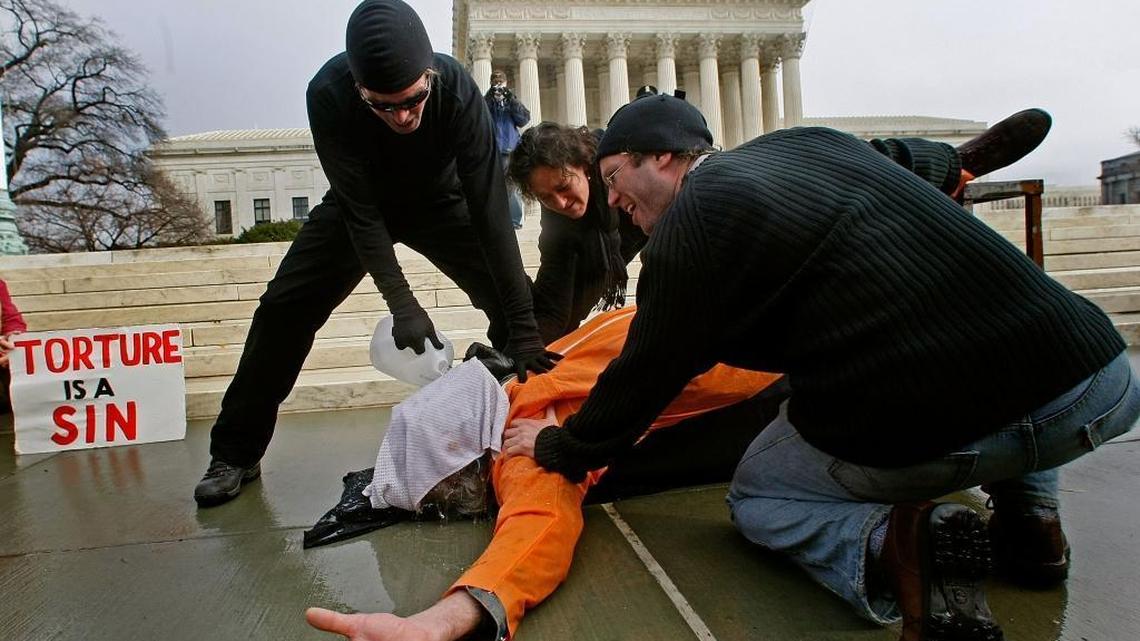 Activists demonstrate “water boarding” technique during a protest in front of the U.S. Supreme Court, Jan. 11, 2007 in Washington D.C.