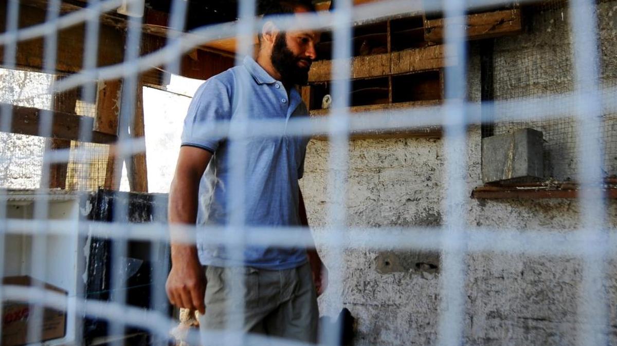 In this photo dated Sunday, June 18, 2017, Salah Sassi , a former Guantánamo detainee, is pictured during an interview with the Associated Press at his home in Bizerte, northern Tunisia. Two Tunisians freed after years in the U.S. detention center at Guantanamo Bay, Cuba, say they are harassed relentlessly by security forces at home. Neither has ever been charged, and they say they almost yearn to return to captivity in Cuba than face the injustice and isolation they say they now endure.