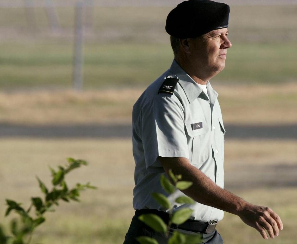 Army Col. James L. Pohl enters the judicial complex at Fort Hood, Texas, for a court-martial on July 7, 2005.