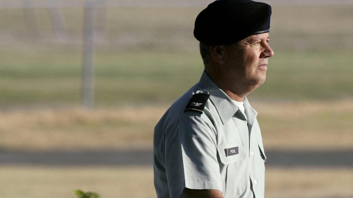 Army Col. James L. Pohl enters the judicial complex at Fort Hood, Texas, for a court-martial on July 7, 2005.