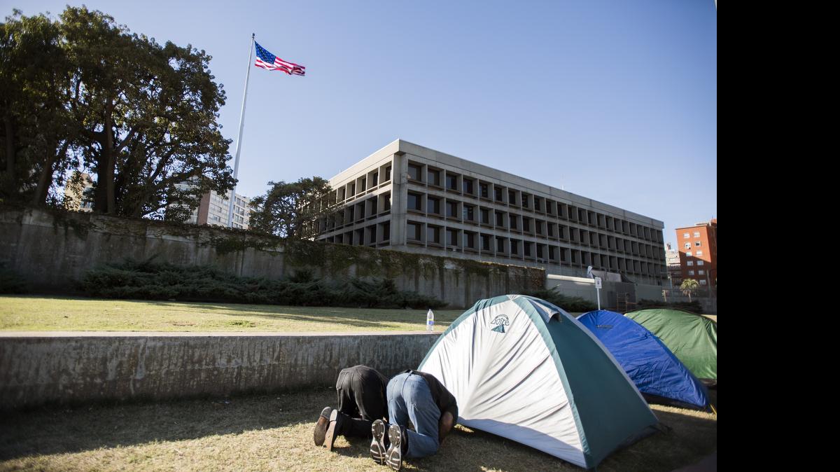 
Former Guantánamo detainee Ali Husain Shaaban of Syria, right, and Adel bin Muhammad el Ouerghi of Tunisia at prayer on May 5, 2015 during their protest outside the U.S. Embassy in Montevideo, Uruguay.
