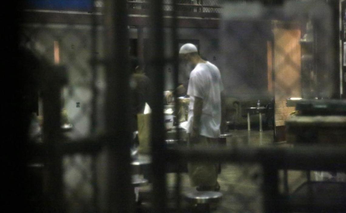A detainee stands in the common area of the cell block on Feb. 11, 2017, at Camp Six at Guantánamo’s Detention Center Zone. The military approved release of this photo.