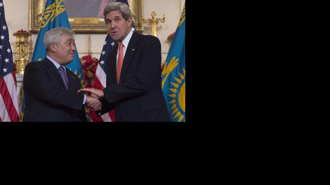 
U.S. Secretary of State John Kerry shakes hands with Kazakhstan Foreign Minister Yerlan Idrisov, left, before a working lunch at the State Department in Washington, D.C., Dec. 10, 2014. 
